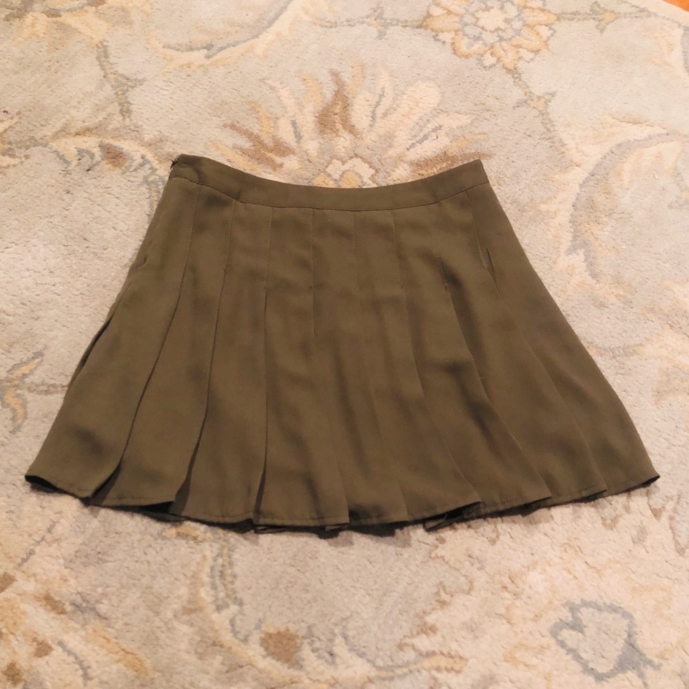 Green pleated skirt